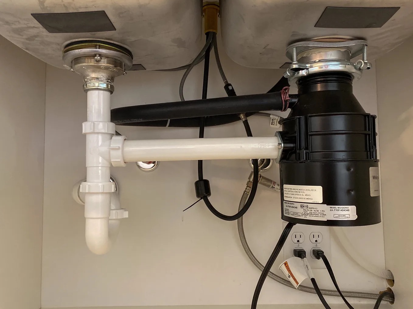 Leaky Garbage Disposal Cleanup in Greater Lansing, MI